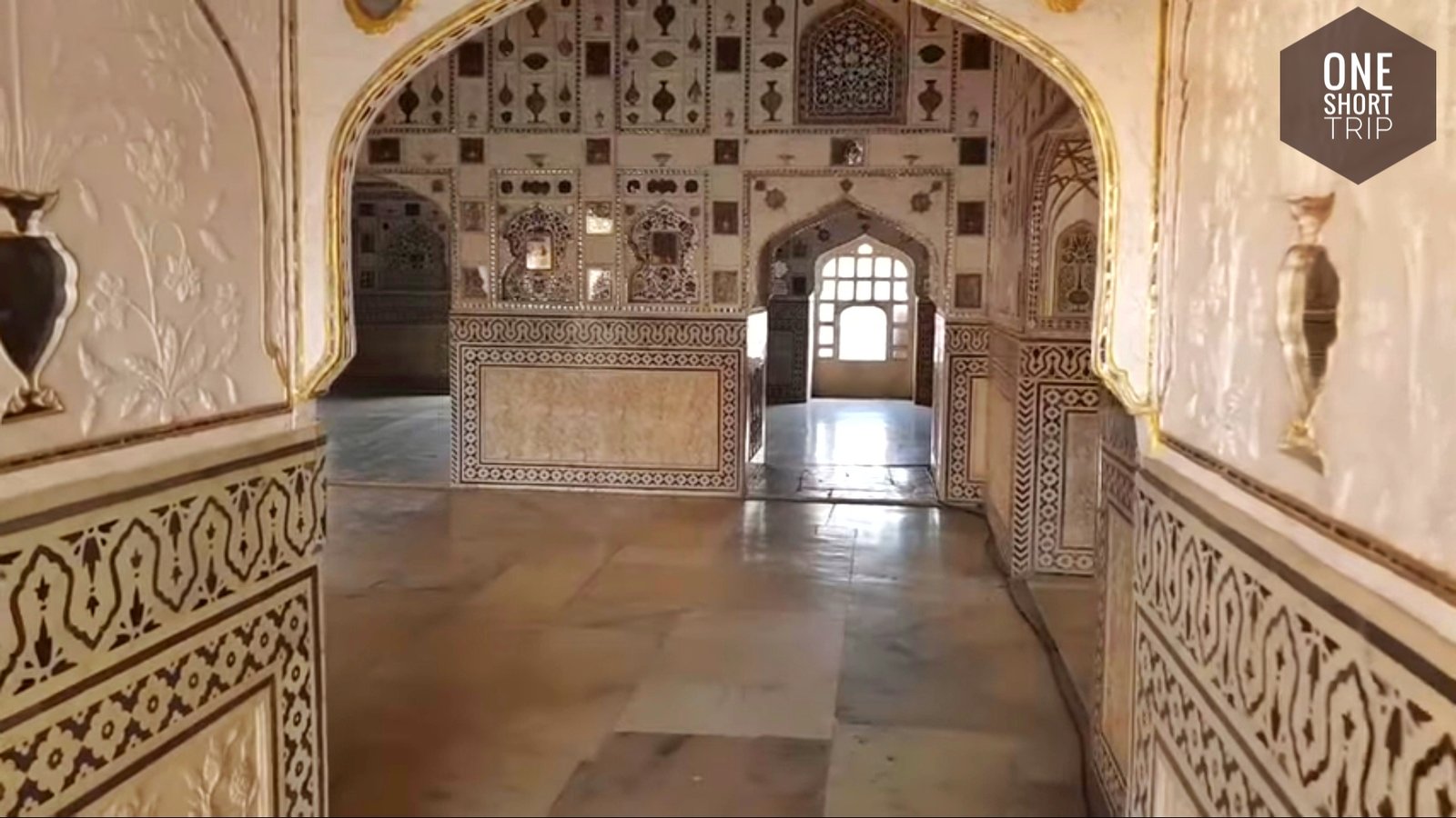 Historic royal halls and stonework inside Amer Fort