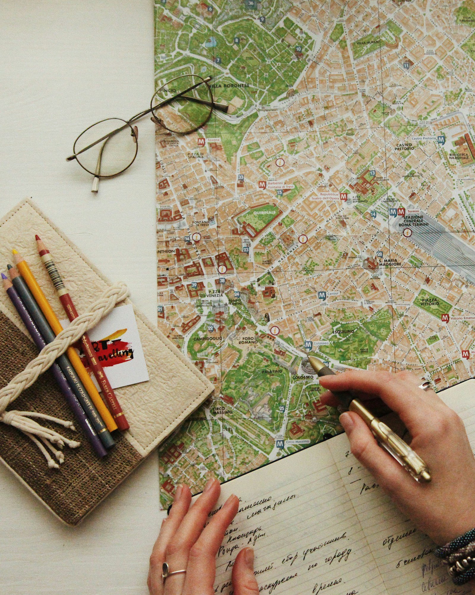 Why Choose One Short Trip 1 Hand-written travel notes and a map used to plan a trip